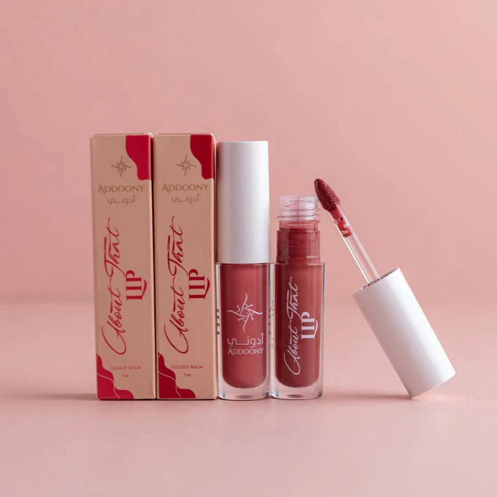 Lipstick with packaging on a pink background