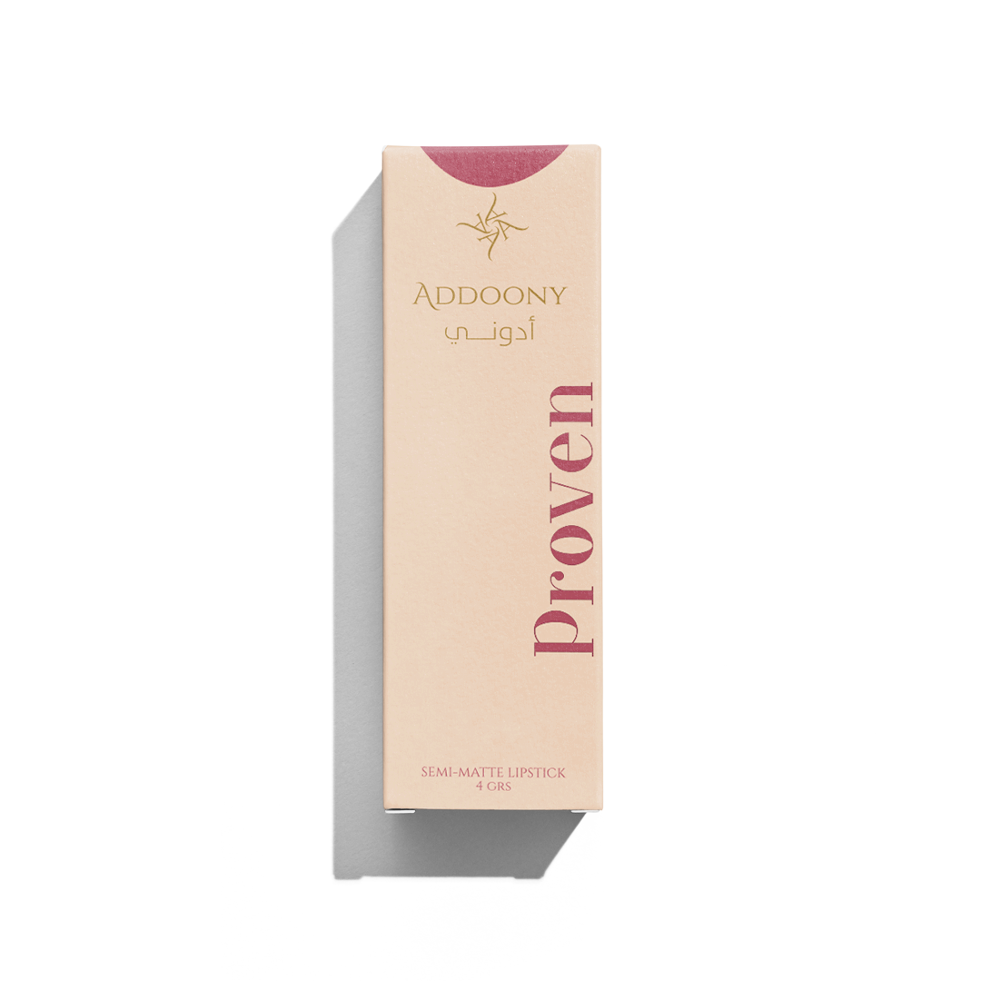 Addoony Beauty Proven lipstick in a sleek tube with a rich, vibrant red shade, showcasing the elegant packaging.