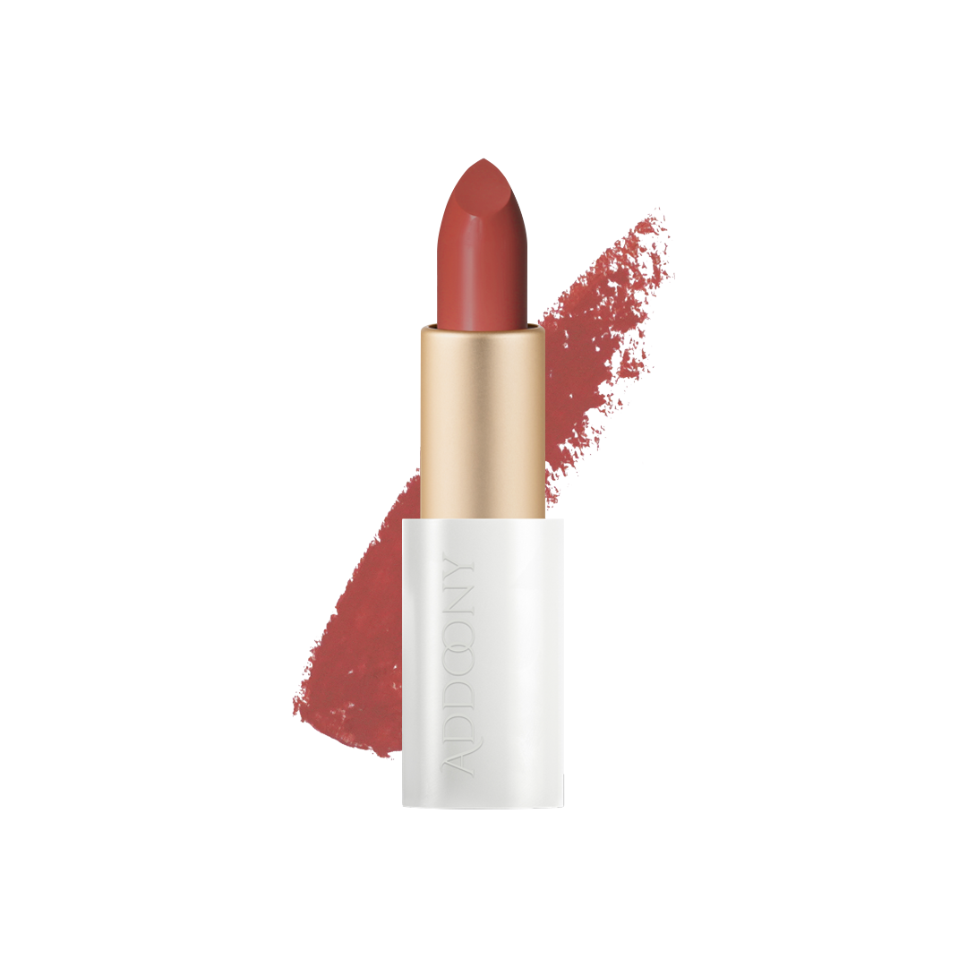 Addoony Beauty Proven Lipstick in Qataf with swatch showing rich, vibrant color on lips and skin.