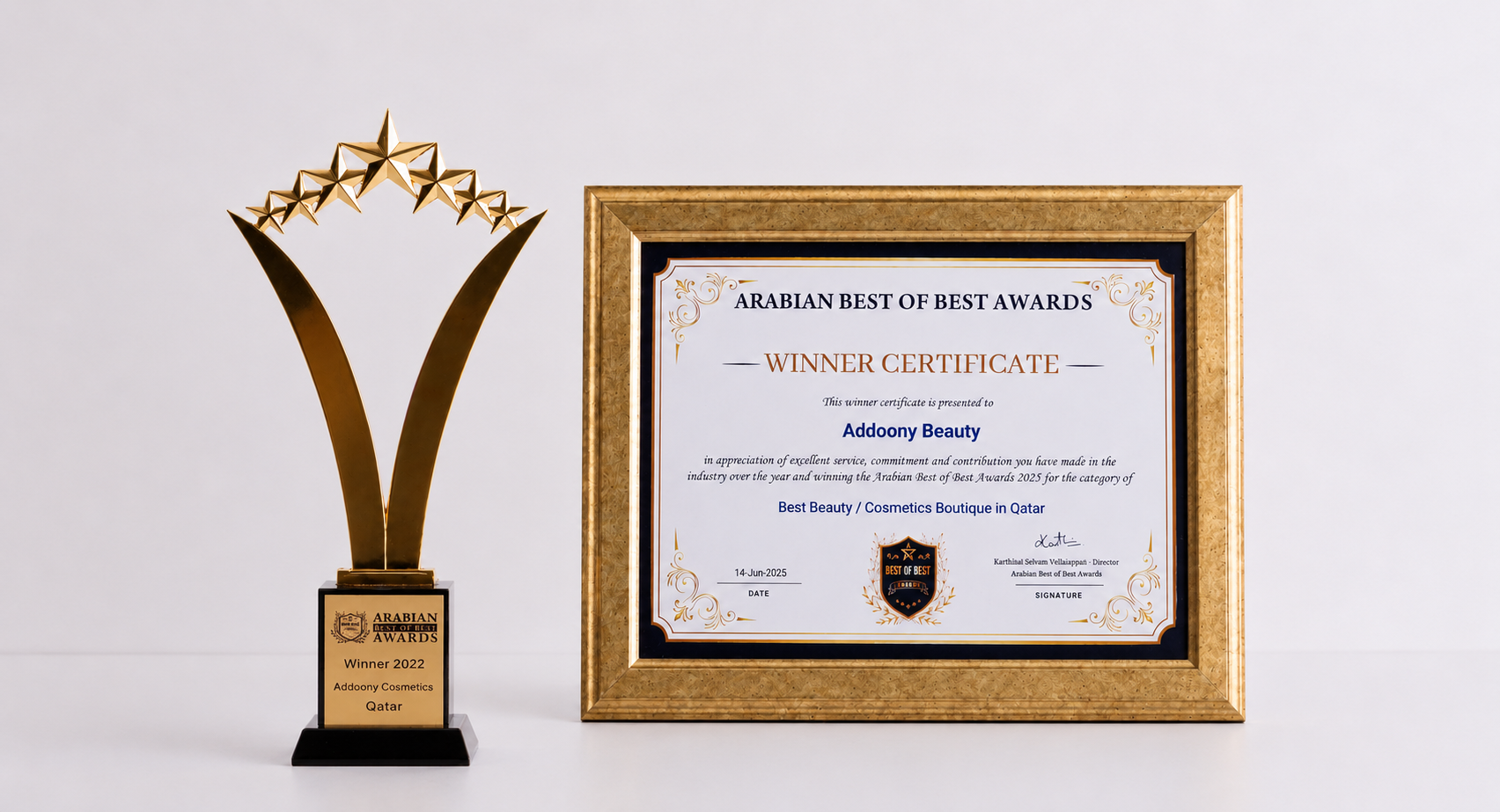 A gold award trophy and a framed 'Arabian Best of Best Awards Winner Certificate' for Addoony Beauty, displayed side-by-side on a clean white background.