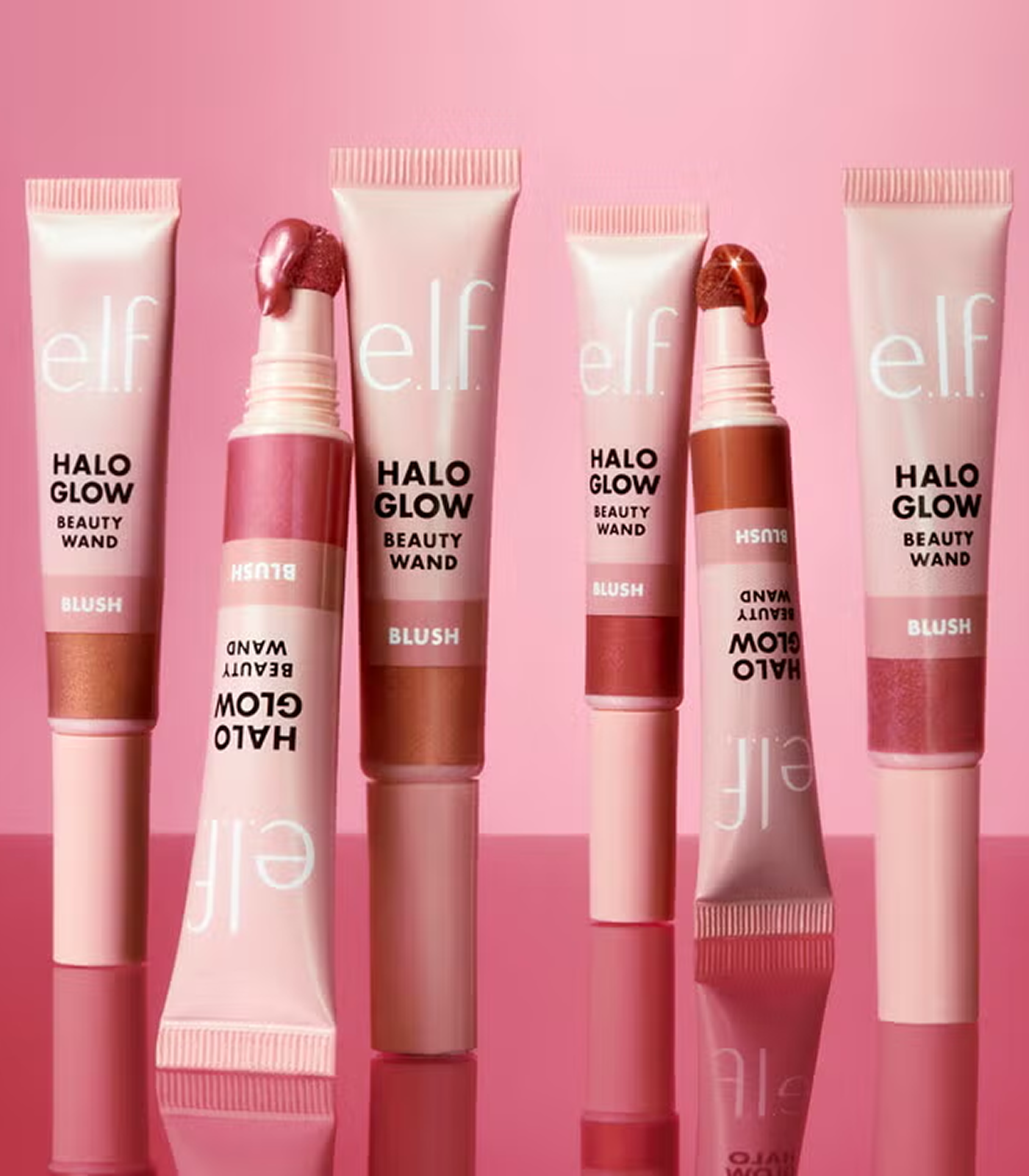 Set of e.l.f. Halo Glow Beauty Wands on a pink background