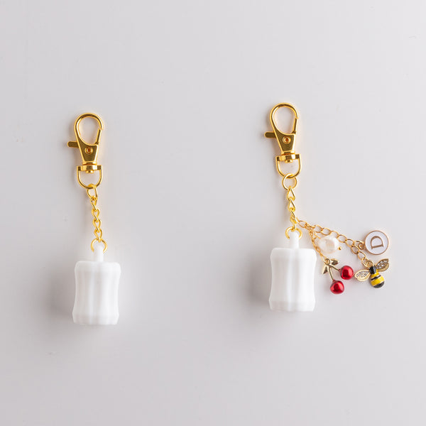 Addoony Lip Oil Bag Charm (Gold & White) تعليقة الحقيبة حامل الليب أويل
