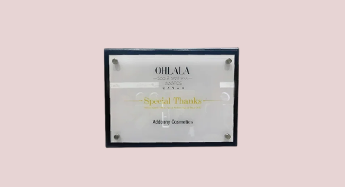 Plaque with 'Ooh La La' branding on a light pink background