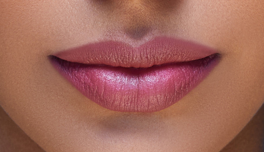 Addoony Beauty lipstick in a warm tan shade, showcasing smooth, creamy texture and sleek packaging.